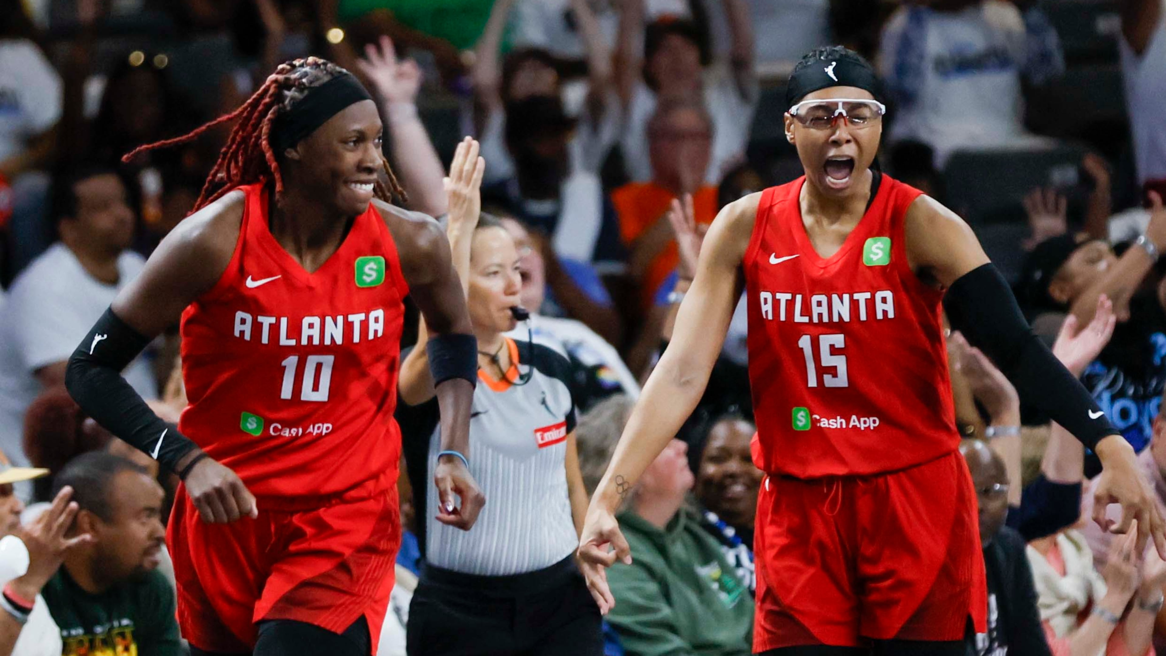 Atlanta Dream guard Allisha Gray (15) racts with her teammate Atlanta Dream guard Rhyne Howard (10) after a basket during the second half of a WNBA basketball first-round playoff game against the Indiana Fever at Gateway Center Arena on Sunday, Sept. 14, 2024, in Atlanta. 
(Miguel Martinez/ AJC)