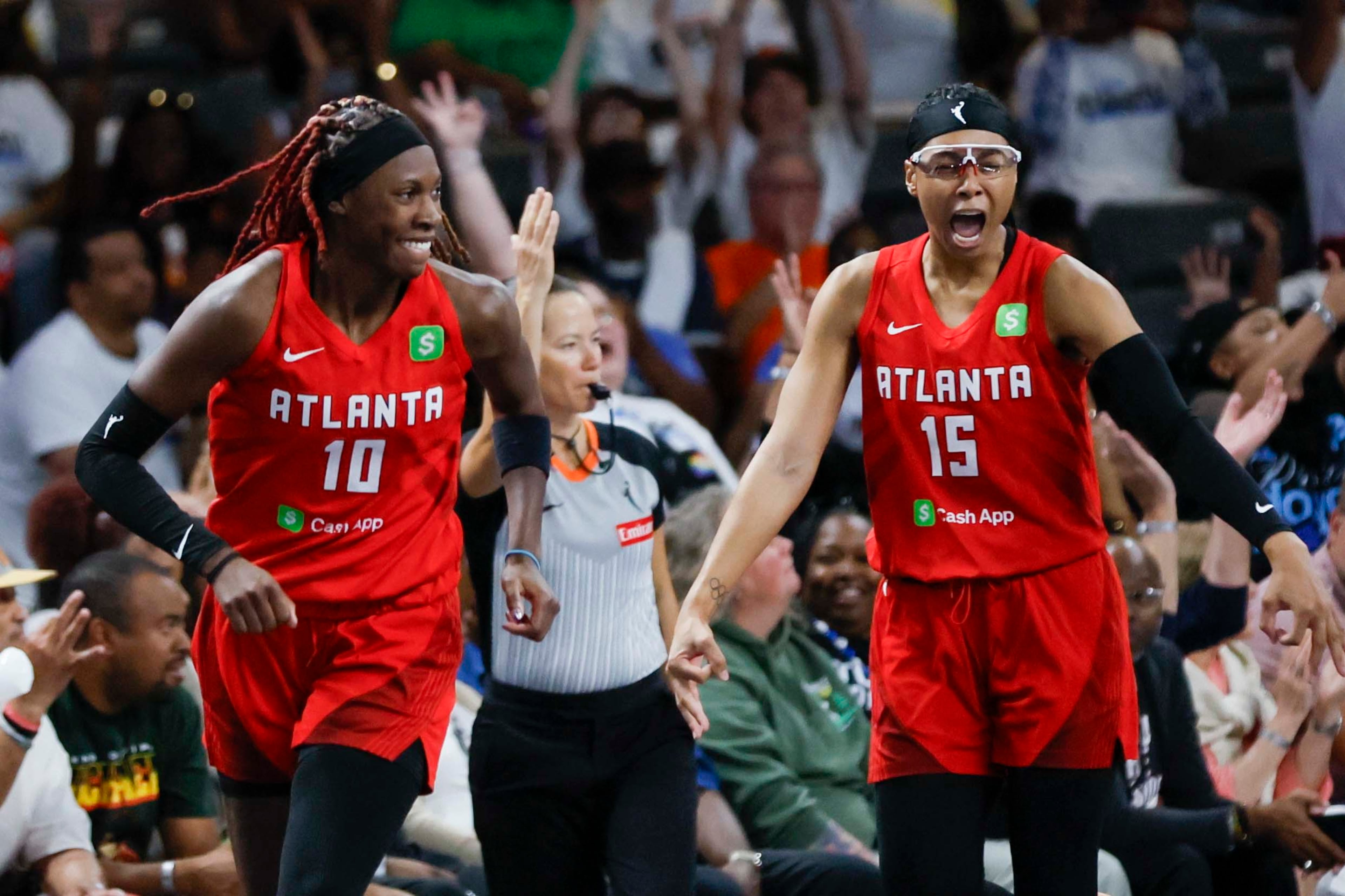 Atlanta Dream guard Allisha Gray (15) racts with her teammate Atlanta Dream guard Rhyne Howard (10) after a basket during the second half of a WNBA basketball first-round playoff game against the Indiana Fever at Gateway Center Arena on Sunday, Sept. 14, 2024, in Atlanta.
(Miguel Martinez/ AJC)