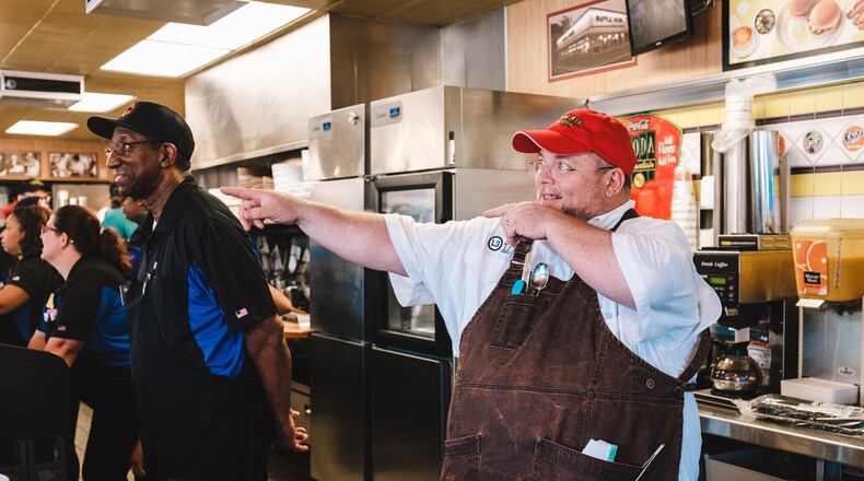 Atlanta chef Chris Hall is a fan of Waffle House. The three-time Waffle House Smackdown culinary champ and proud Waffle House jukebox owner even received a cease-and-desist order from the company after putting a Waffle House-inspired dish on the menu at Local Three. Here, he cooks at the Waffle House on Piedmont Road in Buckhead for a multicourse Waffle House-inspired dinner to benefit local nonprofit the Giving Kitchen. CONTRIBUTED BY WILLIAM BRAWLEY