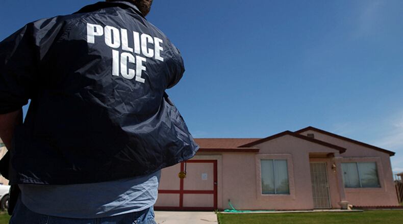 An Immigration and Customs Enforcement officer outside a home where a tunnel under the border was recently found, in Calexico, Calif., March 21, 2005. Enthusiasm for the Trump administration's policy on deportations is high among ICE agents, many of whom chafed under the Obama administration's mandate to focus on gang members and other serious criminals.
