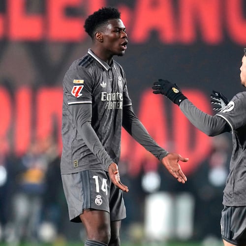 FILE - Real Madrid's Federico Valverde, right, celebrates with Aurelien Tchouameni after scoring his side's opening goal during the Spanish La Liga soccer match between Rayo Vallecano and Real Madrid at the Vallecas stadium in Madrid, Spain, Saturday, Dec. 14, 2024. (AP Photo/Manu Fernandez, File)