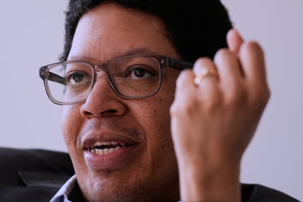 Ellis Monk, professor of Sociology at Harvard University and developer of the Monk Skin Tone Scale, gestures during an interview at his office, Wednesday, Feb. 26, 2025, in Cambridge, Mass. (AP Photo/Charles Krupa)