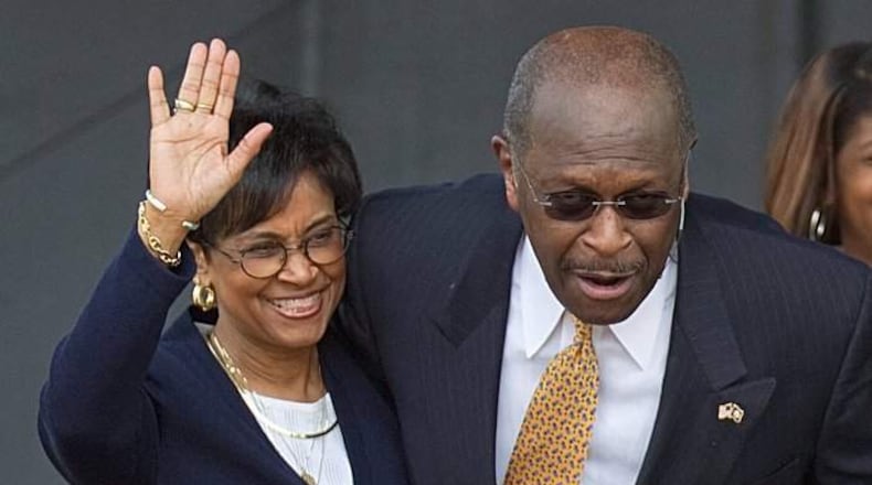 Gloria Cain (left) joins her husband, Herman Cain, four years ago on the campaign trail. “I focus first and foremost on being Christian and try not to look at labels politically,” she said. “I look at people, what they stand for and if their principles align with mine.” David Goldman/AP