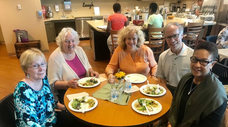 Participants at the Thomas F. Chapman Family Cancer Wellness Center in Atlanta gather for lunch after a t’ai chi class. From left: Jean Delano, Ines Hoster, Elizabeth A. Stevenson, Jeff Stevenson and Angela Hunte. The center is one of four in the Piedmont health care system providing comprehensive cancer services and programs. Photo: Ligaya Figueras