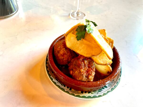 Spanish meatballs with patatas bravas at Ponce City Market’s La Metro. (Angela Hansberger for The Atlanta Journal-Constitution)