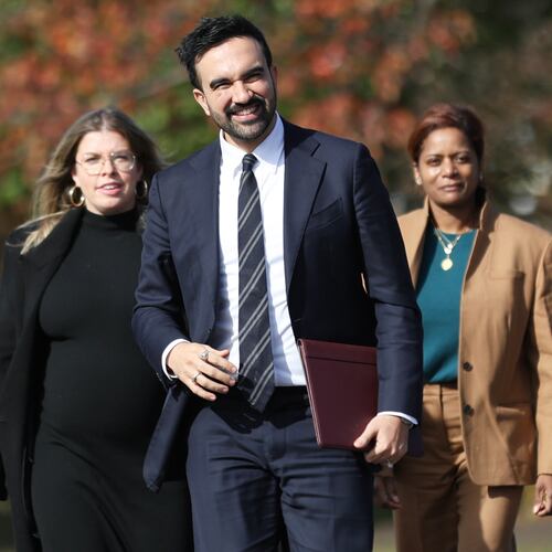 New York City mayor-elect Zohran Mamdani, center, walks with members of his transition team including Elana Leopold, left, and Melanie Hartzog for a news conference in the Queens borough of New York, Wednesday, Nov. 5, 2025. (AP Photo/Heather Khalifa)