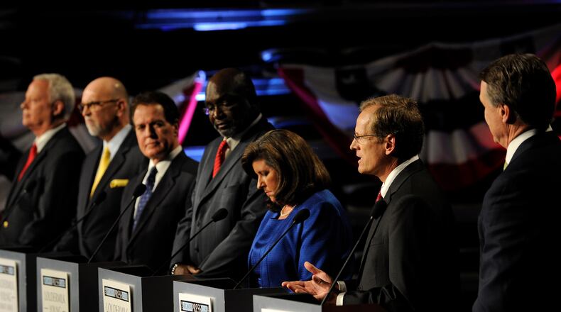 Republican Senatorial candidates, from left to right, Rep. Paul Broun of Athens, Ga., Art Gardner, a patent lawyer, Rep. Phil Gingery of Marietta, Ga., Derrick Grayson, a network engineer, former Georgia Secretary of State Karen Handel, Rep. Jack Kingston of Savannah, Ga., and former Dollar General CEO David Perdue participate in a debate at the Georgia Public Broadcasting studio, Sunday, May 11, 2014, in Atlanta. (AP Photo/David Tulis)