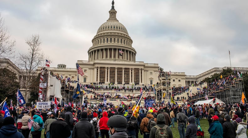 Members of a pro-Trump mob storm the Capitol in Washington, Jan. 6, 2021. What appeared to be racial progress in rural Virginia turned into bitter conflict over a Confederate statue, the election and the Capitol riot. Now, people there foresee “a very dangerous time.” (Jason Andrew/The New York Times)