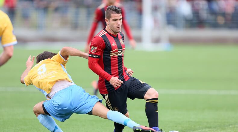 Atlanta United defender Greg Garza (4) make it through a Chattanooga forward in a game Feb. 11.