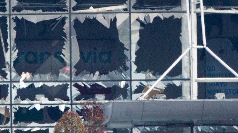 The blown out facade of the terminal is seen at Zaventem airport, one of the sites of two deadly attacks in Brussels, Belgium, Tuesday, March 22, 2016. Authorities in Europe have tightened security at airports, on subways, at the borders and on city streets after the attacks Tuesday on the Brussels airport and its subway system. (AP Photo/Peter Dejong)