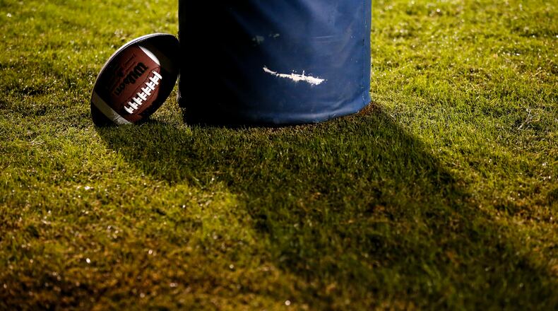 A football rests against the goalpost during the first half of a high school football game between Lanier and Dacula at Dacula High School in Dacula, Ga., on Friday, Oct. 26, 2018. (Casey Sykes for The Atlanta Journal-Constitution)