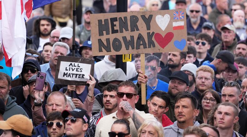 People gather to protest outside Southampton police station, Southampton, England, Tuesday June 2, 2026, after the fatal stabbing of Henry Nowak, a British teenager who was handcuffed despite claiming he was the crime victim. (Gareth Fuller/PA via AP)