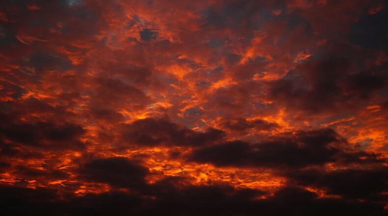 An unusual weather phenomenon caused the skies over Midland, Texas, to glow with a weird red light Tuesday night, similar to this shot of a sunset.