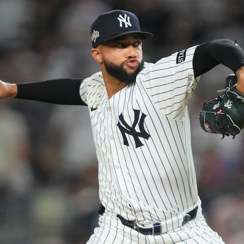 FILE - New York Yankees pitcher Devin Williams delivers against the Toronto Blue Jays during the seventh inning of Game 3 of baseball's American League Division Series, Oct. 7, 2025, in New York. (AP Photo/Yuki Iwamura, File)