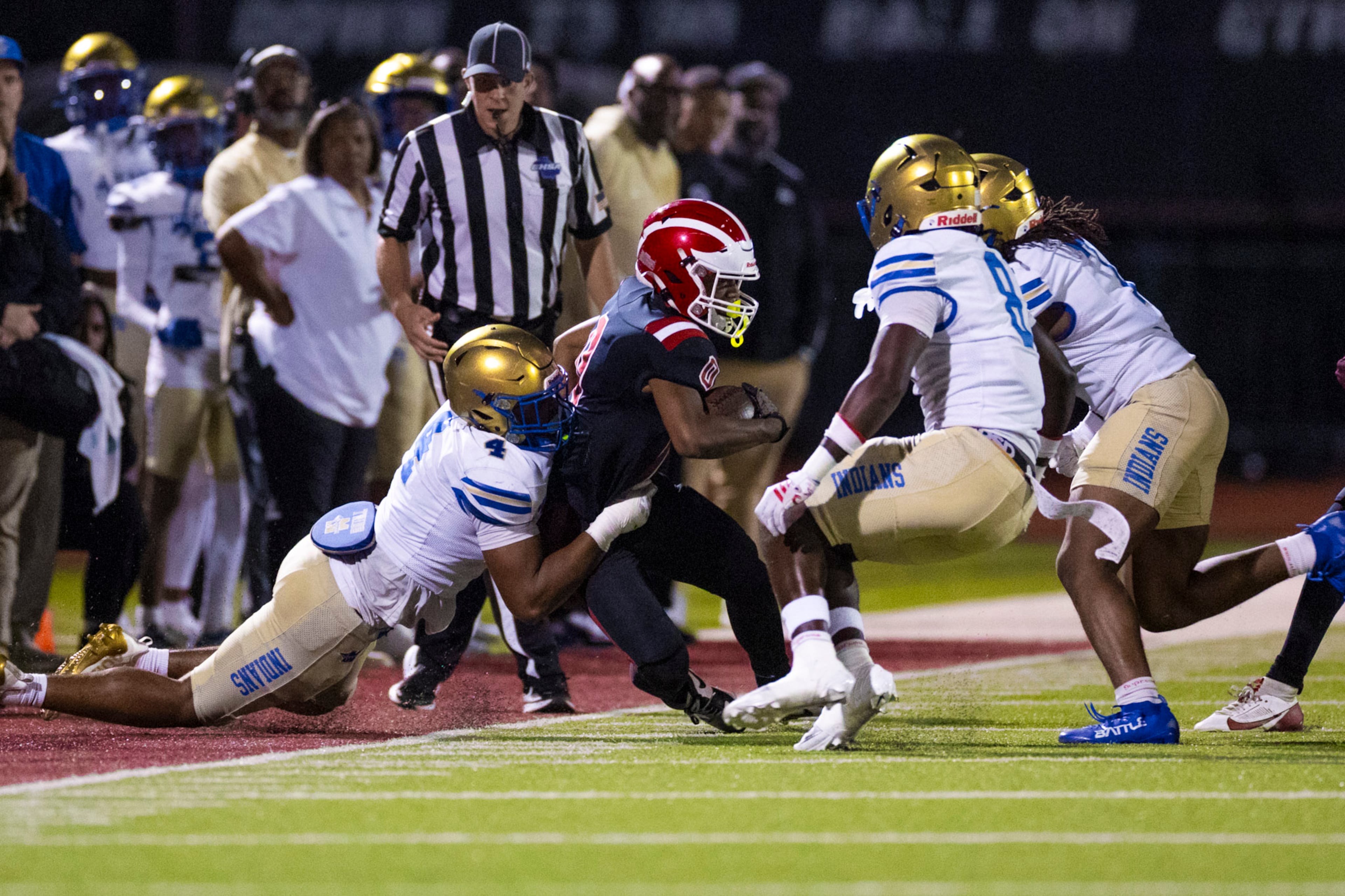 Hillgrove running back Jaiden Moore (0) gets tackled against McEachern at Cobb Energy Hillgrove Stadium in Powder Springs, GA on Friday, October 17th, 2025. (Oscar Guevara Saenz for the AJC)