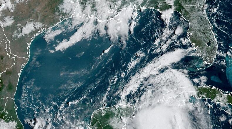 Tropical Storm Idalia gathers strength in the warm waters of the Yucatan Channel between Mexico and Cuba on Monday, Aug. 28, 2023. As Hurricane Idalia charges toward Florida, one factor that could amplify it is the unusually warm water in the Gulf of Mexico — partly the result of the sultry weather that has been smothering the South all summer. (NOAA via via The New York Times) — NO SALES; EDITORIAL USE ONLY —
