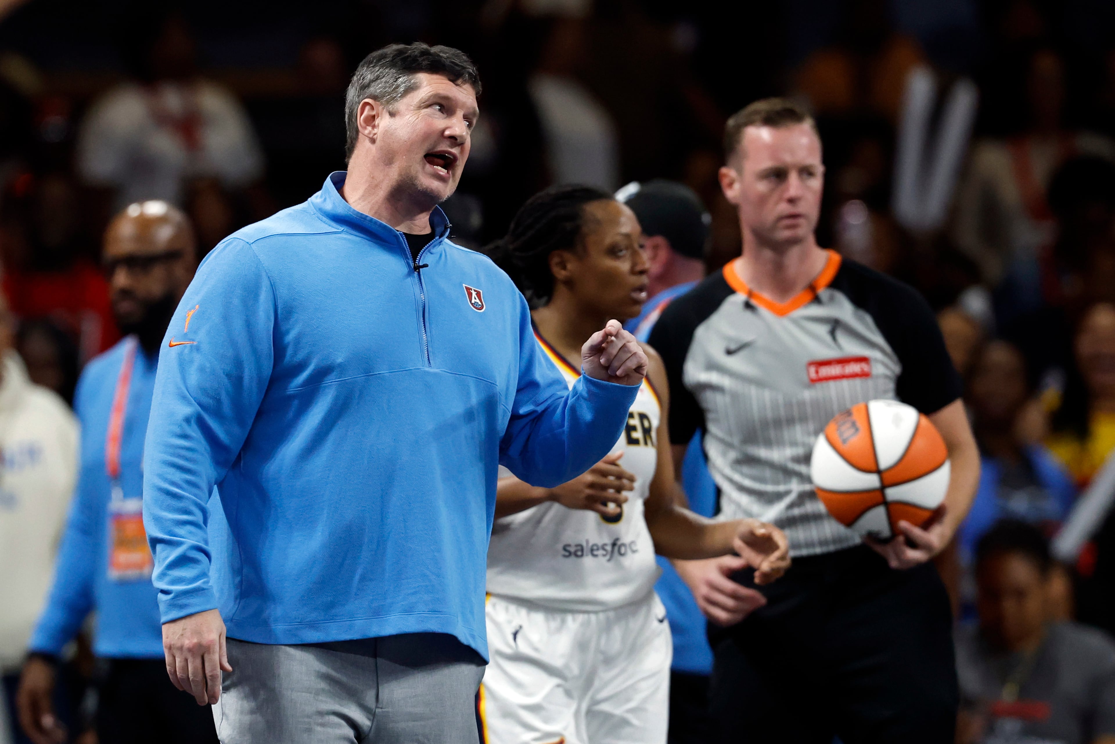 Atlanta Dream head coach Karl Smesko, left, reacts to a call during the second half of Game 3 against the Indiana Fever in the first round of the WNBA basketball playoffs Thursday, Sept. 18, 2025, in Atlanta. (AP Photo/Butch Dill)