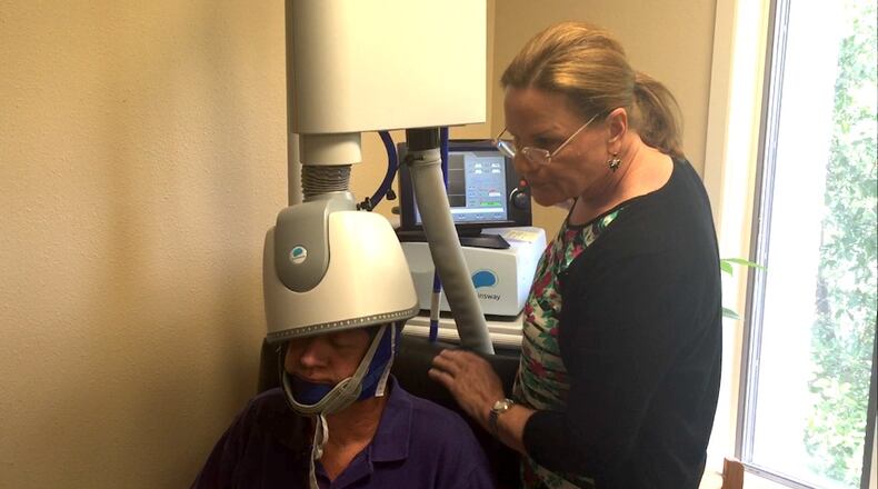 Danny Pyka, a patient at Senior Adult Specialty Healthcare, is fitted with a helmet from Brainsway Ltd. on Tuesday, June 28, 2016, which is used for treatment of major depression. Pyka says he noticed immediate improvement the same week he started treatments.