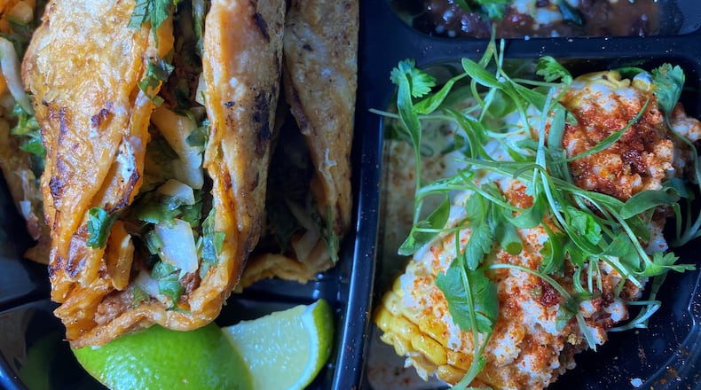 Birria-style braised beef brisket tacos, with sofrito black beans, and hopped chili-lime elote corn. 
Bob Townsend for the Atlanta Journal-Constitution.