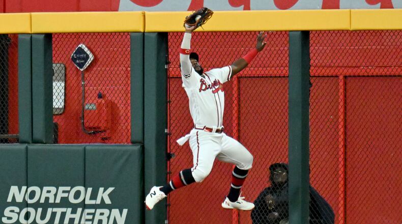 Atlanta Braves center fielder Michael Harris II makes a jump catch the fly ball by Philadelphia Phillies right fielder Nick Castellanos nto a double play to end the ninth inning in the Game 2 of the 2023 National League Division Series at Truist Park, Monday, Oct. 9, 2023, in Atlanta. (Hyosub Shin / Hyosub.Shin@ajc.com)