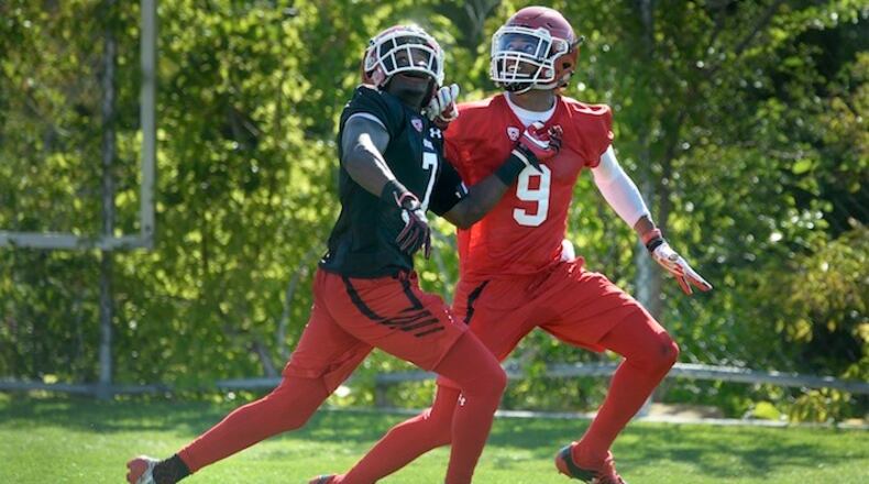 In this July 28, 2017, file photo, Utah wide receiver Darren Carrington II, right, looks back for the ball as he battles with defensive back Jaylon Johnson during the first day of NCAA college football practice for the team in Salt Lake City. Carrington, a graduate transfer from Oregon, has just the kind of experience that makes him a good fit in Salt Lake City. (Scott Sommerdorf/The Salt Lake Tribune via AP, File)
