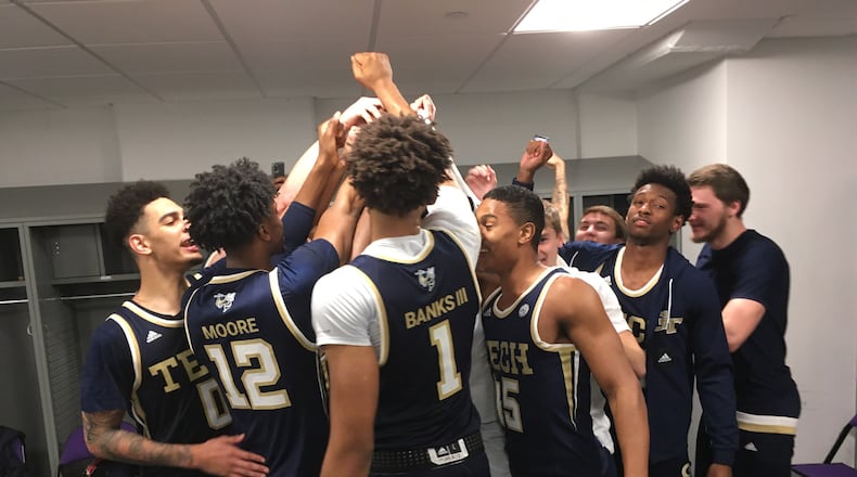 Georgia Tech players gather in a huddle in the locker room following the Yellow Jackets' win over Clemson March 7, 2020, in Clemson, S.C. (Ken Sugiura/AJC)
