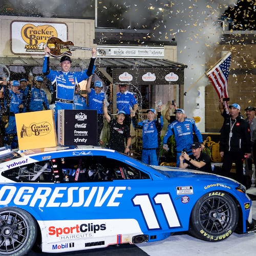Denny Hamlin celebrates after winning a NASCAR Cup Series auto race, Sunday, May 31, 2026, in Lebanon, Tenn. (AP Photo/Camden Hall)
