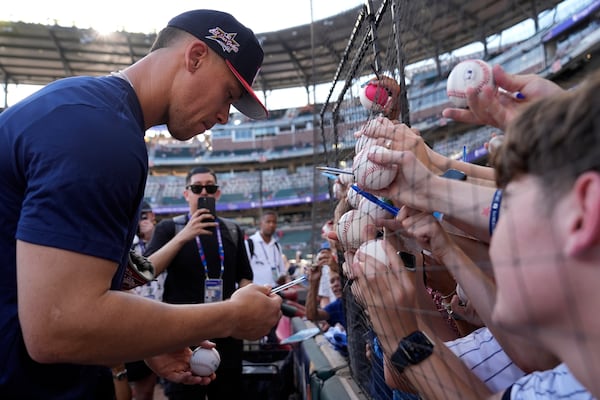 New York Yankees, right fielder Aaron Judge of the American League, signs autographs during batting practice the MLB baseball All-Star game, Monday, July 14, 2025, in Atlanta. (AP Photo/Brynn Anderson)