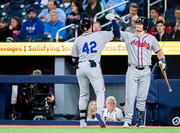 Atlanta Braves infielder Austin Riley (left) celebrates a home run with Sean Murphy in first inning MLB baseball action against the Toronto Blue Jays, in Toronto on Tuesday April 15, 2025. (Thomas Skrlj/The Canadian Press via AP)