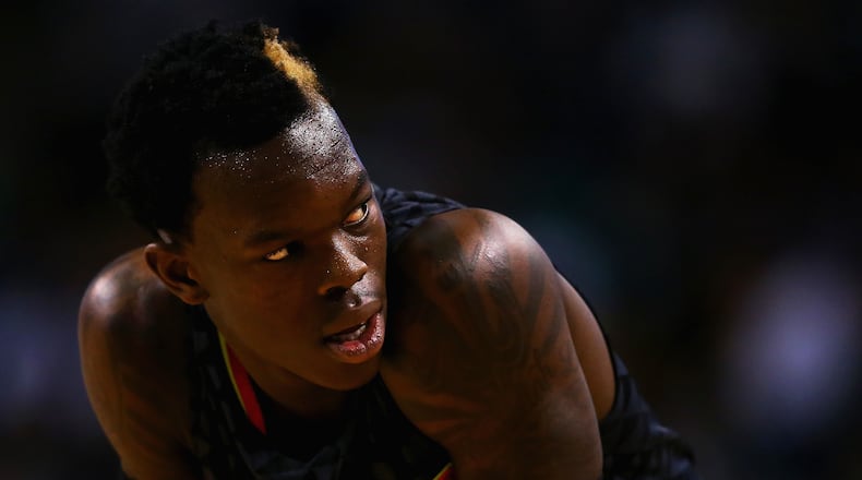 BOSTON, MA - DECEMBER 18: Dennis Schroder #17 of the Atlanta Hawks looks on during the second quarter against the Boston Celtics at TD Garden on December 18, 2015 in Boston, Massachusetts.NOTE TO USER: User expressly acknowledges and agrees that, by downloading and/or using this photograph, user is consenting to the terms and conditions of the Getty Images License Agreement. (Photo by Maddie Meyer/Getty Images)