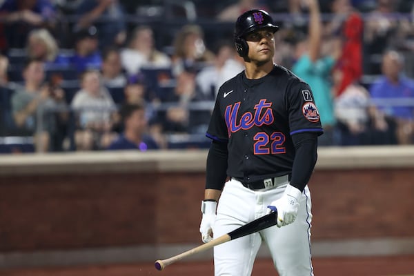 New York Mets' Juan Soto walks to the dugout after being struck out by Atlanta Braves pitcher Dylan Lee during the eighth inning of a baseball game Monday, June 23, 2025, in New York. (AP Photo/Pamela Smith)