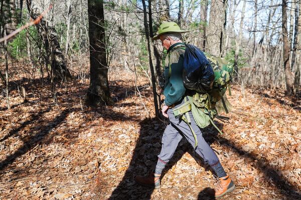 Heyward Hosch hikes on Blood Mountain on Saturday in search of his younger brotherm Charles, who went missing Nov. 11. (Abbey Cutrer/AJC)