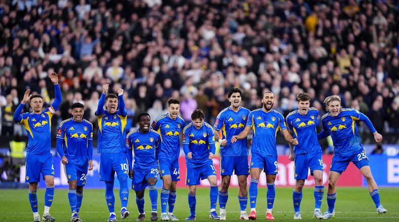 Leeds United's Dominic Calvert-Lewin, third right, and teammates celebrate in the penalty shoot-out during the English FA Cup quarterfinal soccer match between West Ham United and Leeds United, in London, Sunday April 5, 2026. (John Walton/PA via AP)