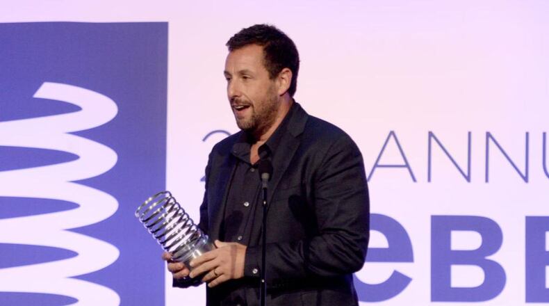 Actor Adam Sandler made a cameo appearance for a Florida couple during their wedding, taking a photo with the newlyweds Saturday.