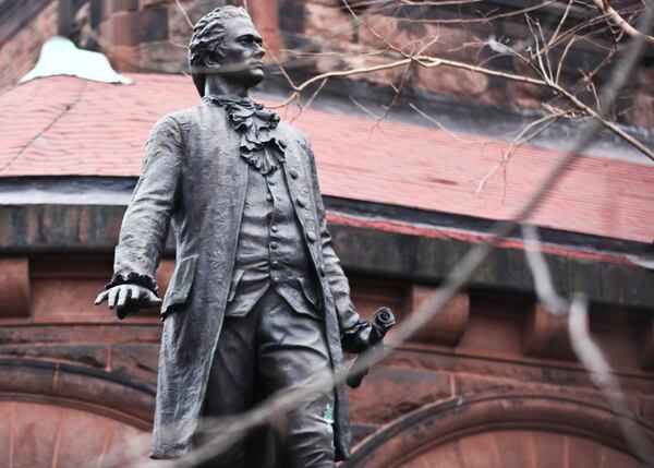 FILE -- A statue of Alexander Hamilton on the grounds of St. Luke's Episcopal Church in New York, Jan. 16, 2016. A paper by a researcher at the Schuyler Mansion finds overlooked evidence in letters and Hamilton’s own account books indicating that he bought, sold and personally owned slaves. (Byron Smith/The New York Times)