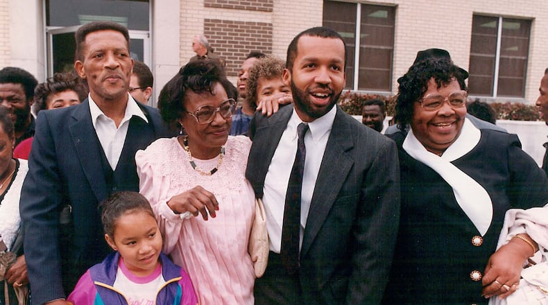 Walter McMillian (from left), his granddaughter, his wife Minnie McMillian, attorney and author Bryan Stevenson and Walter's sister Evalene Smith gather outside the courthouse after Walter's release from prison. McMillian spent six years on death row for a murder he did not commit. Contributed by Equal Justice Initiative