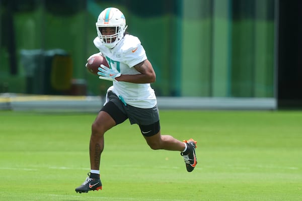 Miami Dolphins wide receiver Jaylen Waddle (17) runs drills during an NFL football practice, Wednesday, May 28, 2025, in Miami Gardens, Fla. (AP Photo/Marta Lavandier)