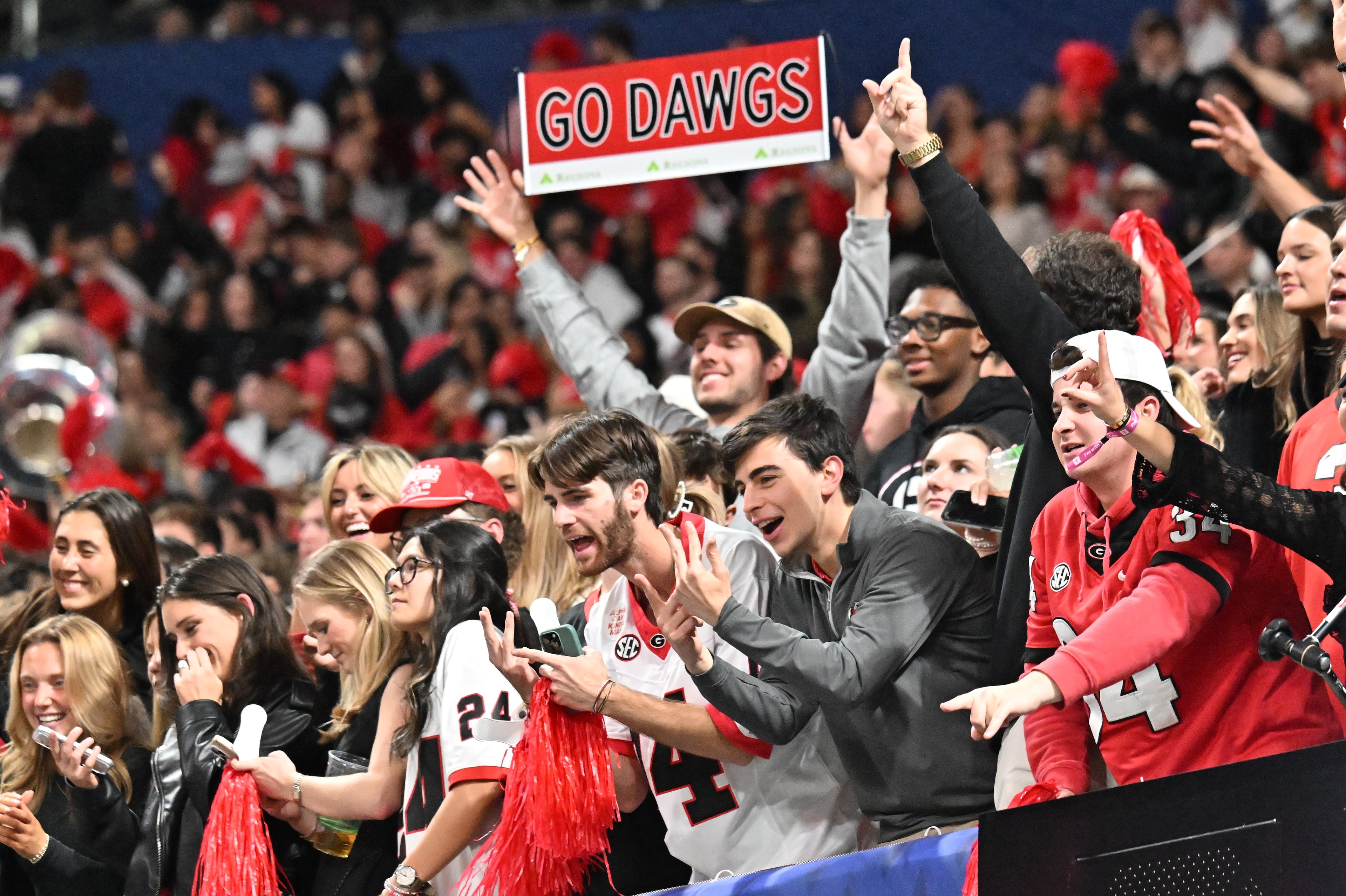 Georgia fans celebrate after defeating Alabama 28-7 in the SEC Championship football game at the Mercedes-Benz Stadium, Saturday, December 6, 2025 in Atlanta. (Hyosub Shin / AJC)