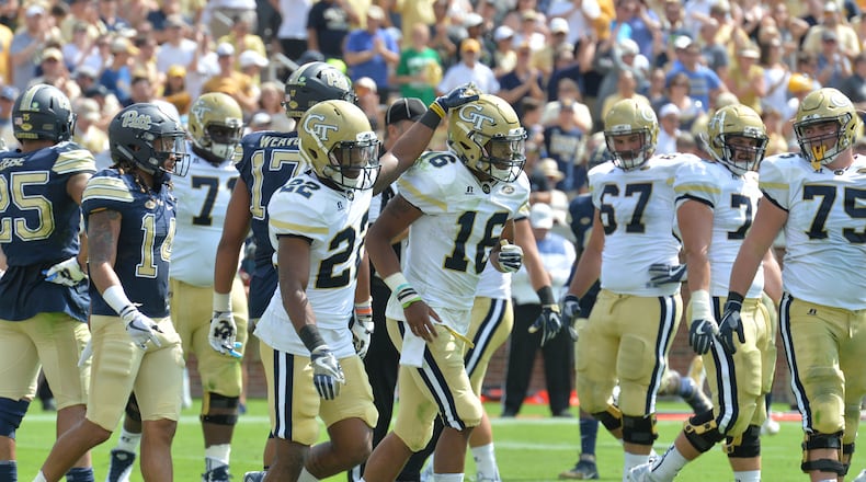 Georgia Tech quarterback TaQuon Marshall (16) and running back Clinton Lynch (22) celebrate at Bobby Dodd Stadium on Saturday, September 23, 2017. Georgia Tech won 35-17 over Pittsburgh. HYOSUB SHIN / HSHIN@AJC.COM