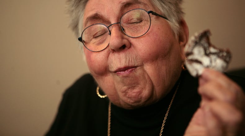 081110 ATLANTA, GA - During a portrait session, Atlantan chemist and cookbook author Shirley Corriher takes a bite of a chocolate crinkle cookie, closes her eyes and says "Mmmmm," on November 10, 2008. Corriher made a book signing appearance with Food Network's Alton Brown at the Margaret Mitchell House on November 10, 2008. Corriher is the author of "CookWise" and the newly released "BakeWise." JESSICA MCGOWAN / jmcgowan@ajc.com