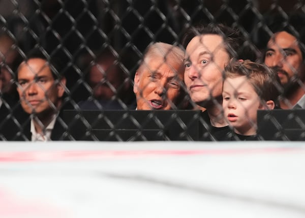 President Donald Trump, from foreground center to right, Elon Musk, his son X Æ A-Xii, and in background at left, Secretary of State Marco Rubio attend a mixed martial arts fight at UFC 314, Saturday, April 12, 2025, in Miami. (AP Photo/Lynne Sladky)