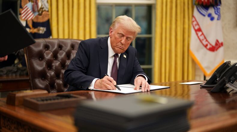 President Donald Trump signs executive orders in the Oval Office of the White House shortly after his inauguration on Monday, Jan. 20, 2025. Even more than in his first term, Trump has mounted a fundamental challenge to the norms and expectations of what a president can and should do. (Doug Mills/New York Times)