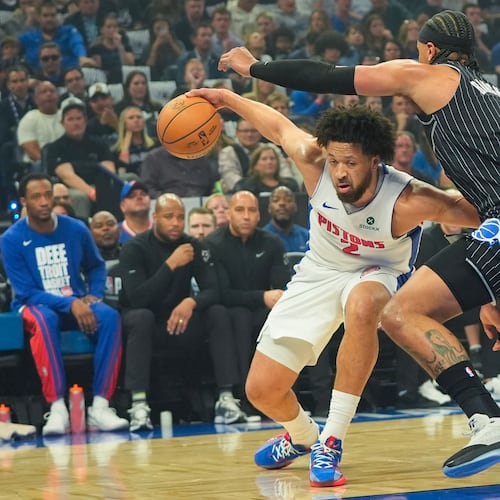 Detroit Pistons guard Cade Cunningham, left, tires to get past Orlando Magic forward Paolo Banchero, right, during the first half in Game 6 of a first-round NBA basketball playoffs series, Friday, May 1, 2026, in Orlando, Fla. (AP Photo/John Raoux)