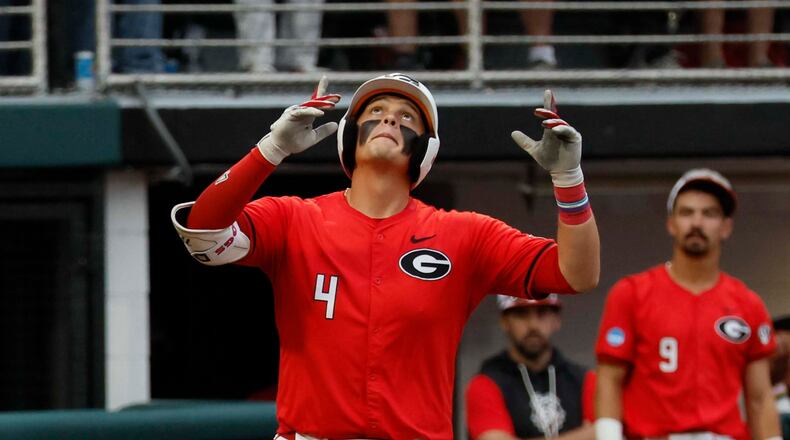 Georgia Bulldogs infielder Michael O’Shaughnessy reacts at home plate after his solo home run during the eighth inning of their NCAA Regional final game at Foley Field on Sunday, May 31, 2026, in Athens. (Miguel Martinez/AJC)