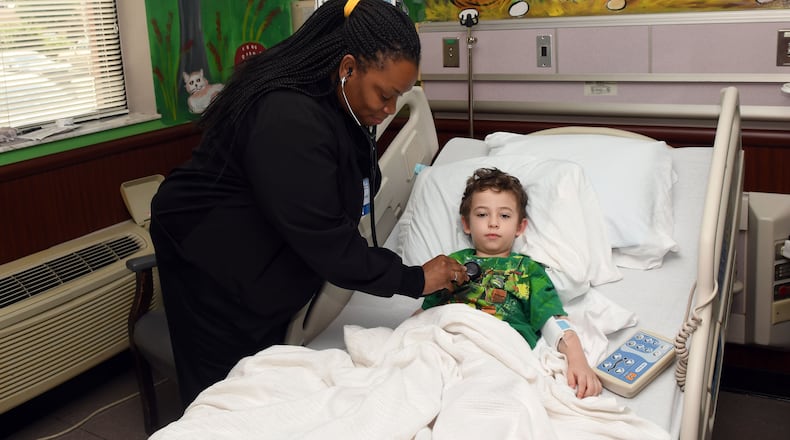Pediatric RN Shareem Wrease examines Trevor Rozier, 4, of Eastman, at Dodge County Hospital in Eastman, Georgia on September 21, 2017. This hospital benefits from several federal funding programs for hospitals that are rural, or treat the poor, or treat working class kids -- all of which are slated to see cuts or expire Sept. 30 if they're not renewed. (Rebecca Breyer)