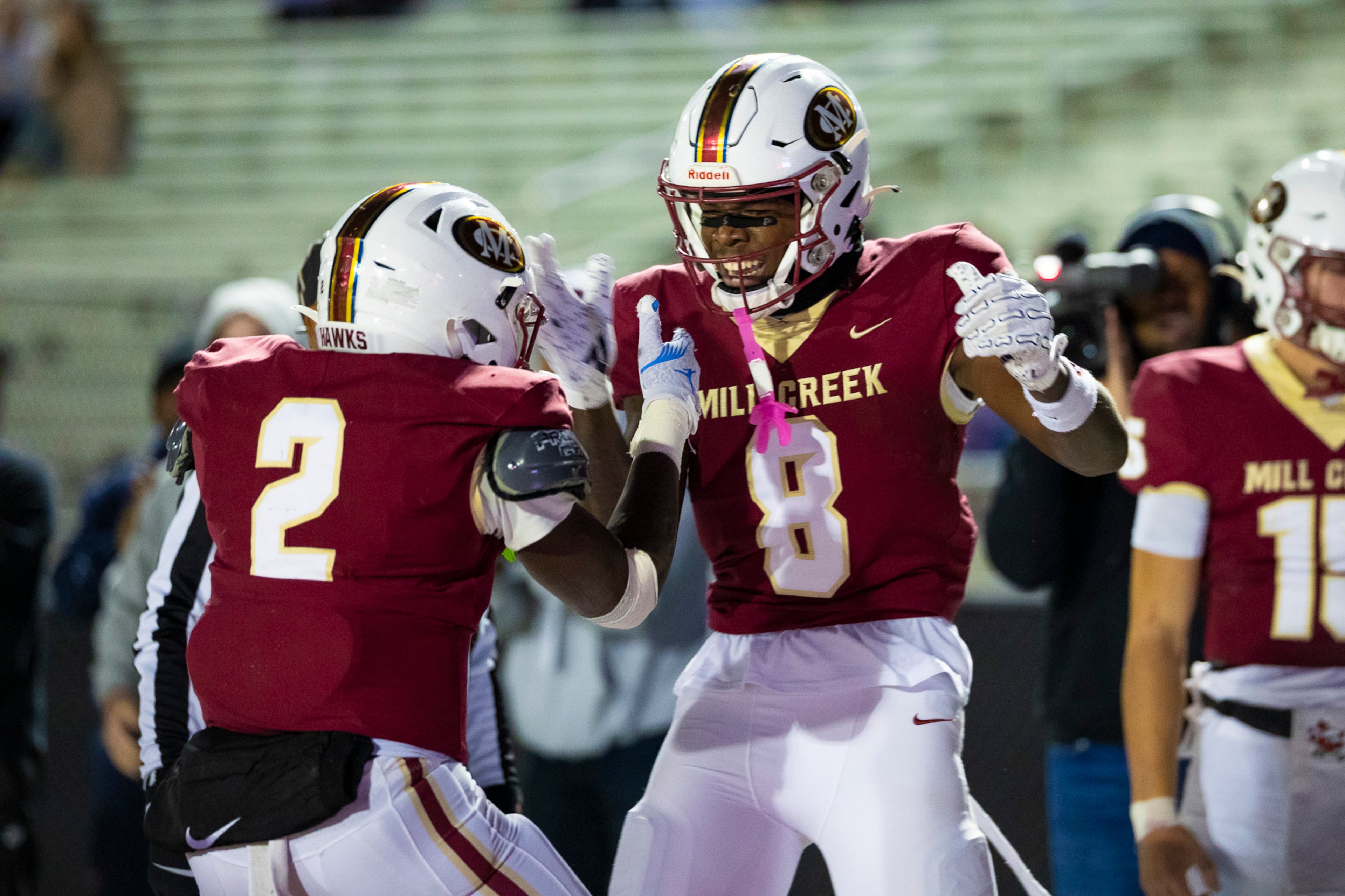 Mill Creek wide receiver Devin Hamilton (8) celebrates a touchdown with running back Jayde Beasley (2) in the first half against Colquitt at Mill Creek Community Stadium in Hoschton on Nov. 14th, 2025. (Oscar Guevara Saenz for the AJC)