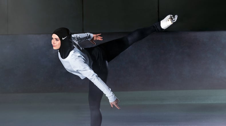 In this undated image provided by Nike, figure skater Zahra Lari model wears Nike's new hijab for Muslim female athletes. (Nike via AP)