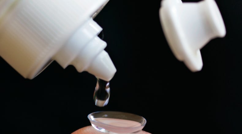 Contact lenses require proper care to avoid infection. Many adolescents exhibit a habit that puts them at risk, a new study found. (AP Photo/Paul Sakuma)