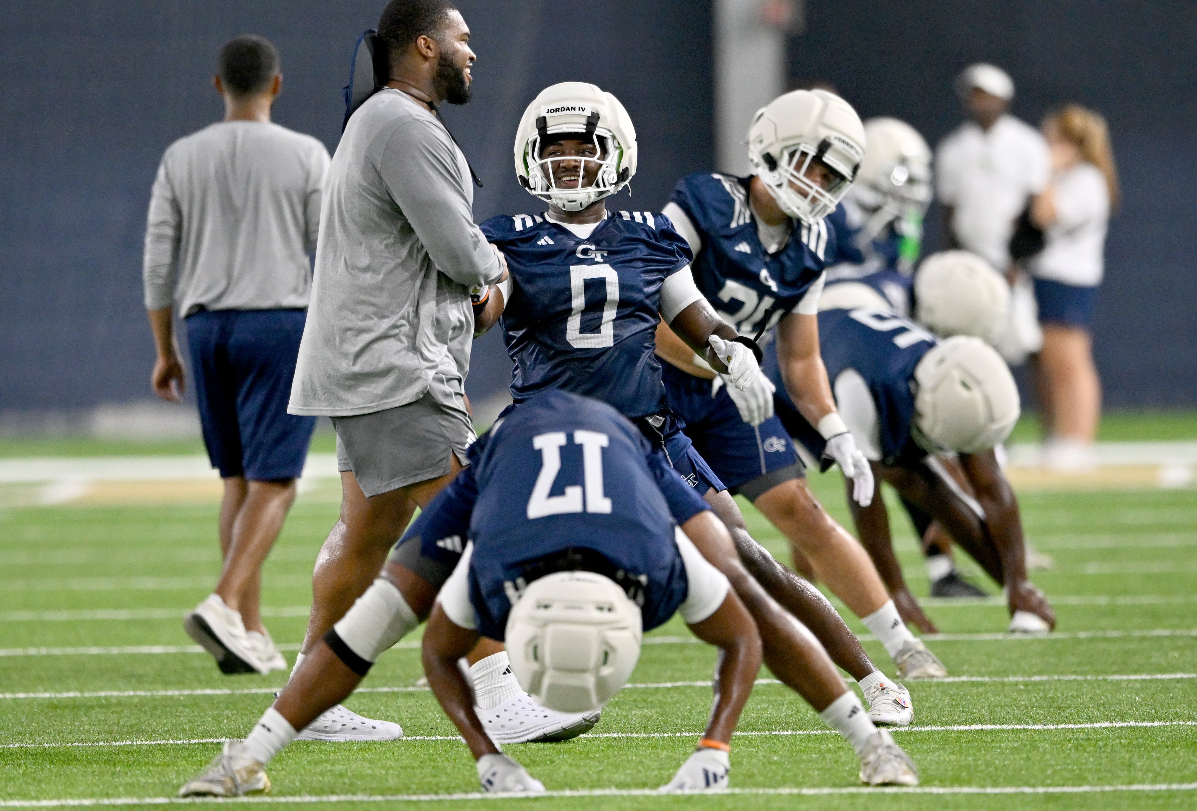 Georgia Tech linebacker Melvin Jordan IV (0) reacts as he and other players warm up during the first day of football practice at Rose Bowl Field and the Mary and John Brock Football Practice Facility, Tuesday, July 29, 2025, in Atlanta. (Hyosub Shin / AJC)