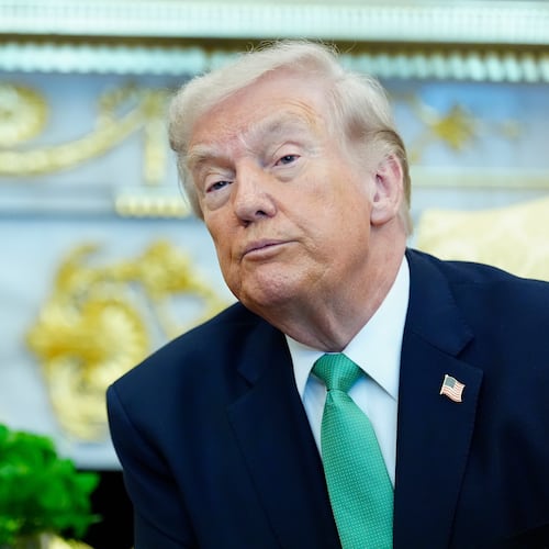 President Donald Trump listens to a reporter's question during a meeting with Irish Prime Minister Micheál Martin in the Oval Office of the White House, on St. Patrick's Day, Tuesday, March 17, 2026, in Washington. (AP Photo/Alex Brandon)